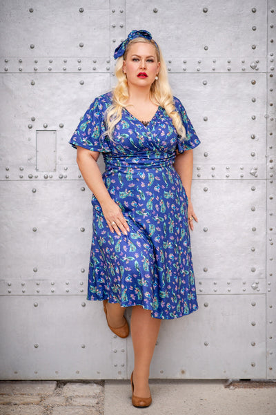 Donna Petal Sleeved Dress in Purple and Peacock Print
