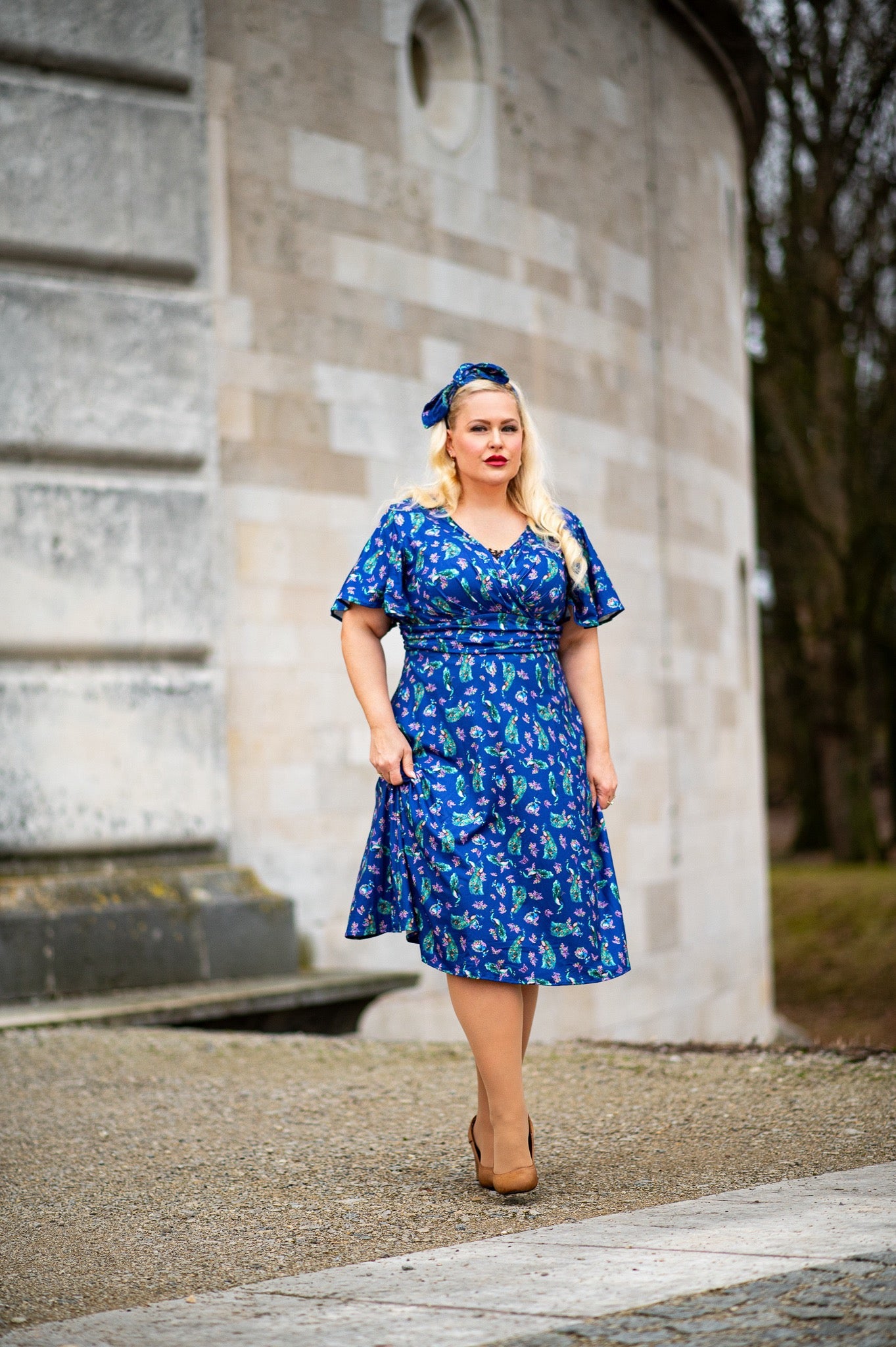 Donna Petal Sleeved Dress in Purple and Peacock Print