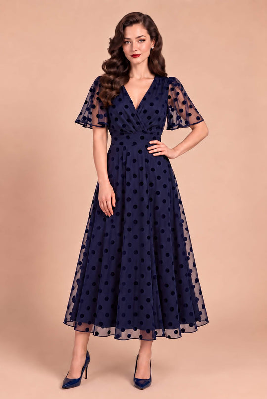 A lovely model in Marianne Navy Polka Dot Wedding Guest Dress