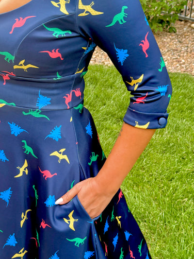 Scarlette Long-Sleeved Stretchy Dress in Navy and Colourful Dino Print