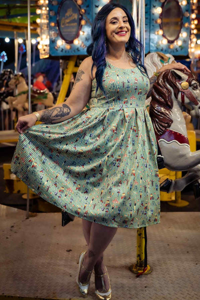 A lady wearing a Green Circus Striped Flared Dress