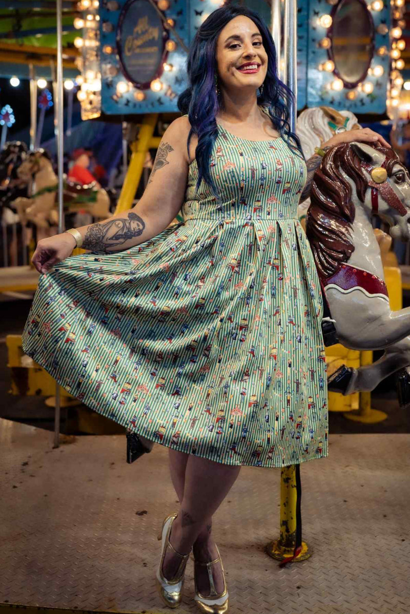 A lady wearing a Green Circus Striped Flared Dress