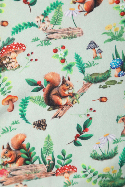 Close up view of Squirrel Woodland Print Tea Dress in Green