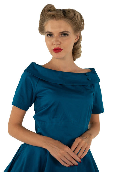 Vintage-inspired Peacock Blue Swing dress with pockets and sleeves
